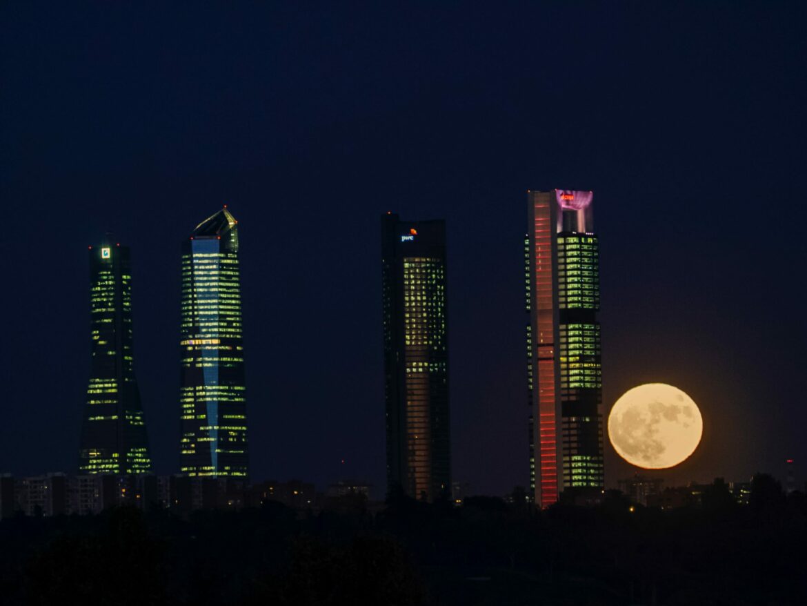 Orange-glowing-moon-over-Madrid-Skyline_