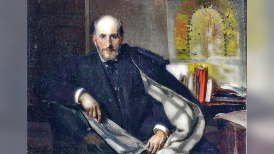 Oil painting: Santiago Ramón y Cajal, an older man with a grey beard in a dark suit, sits in an armchair with a light shawl over his knees, books on a shelf behind him.