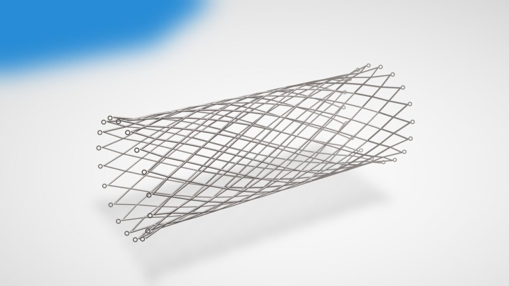A bare nitinol stent: an open tube of thin silver zigzag metal struts in a diamond pattern, lying on a white surface.